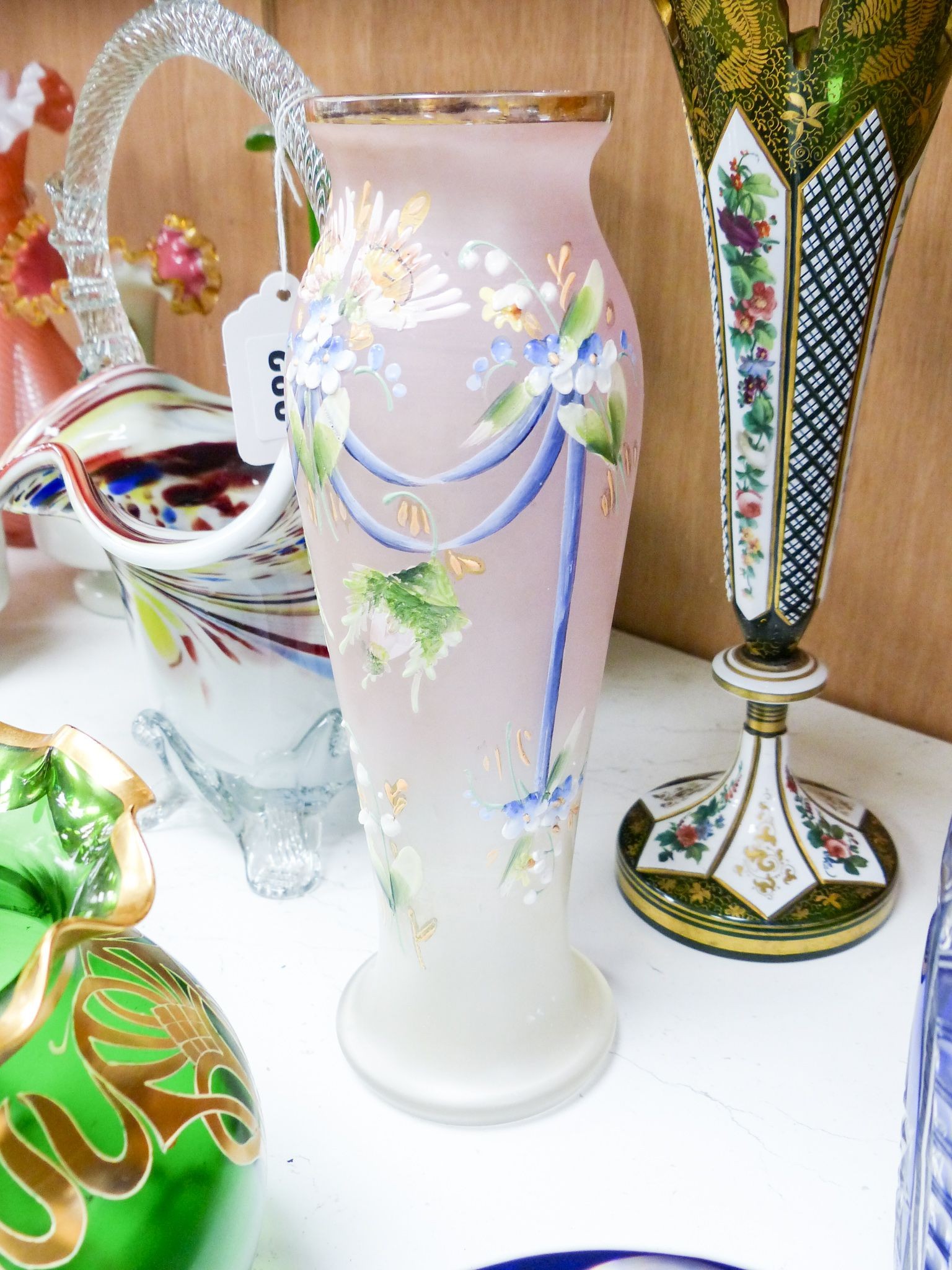 A group of Victorian style fancy glass vases and jugs and other coloured cut glass etc., tallest 29 cm